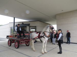 A horse and cart arrival outside the crematorium building